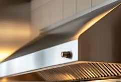 Modern Stainless Steel Air Vent Hood in Restaurant Kitchen Close-Up Shot with Ambient Lighting